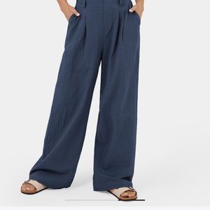 HALARA High Waisted Plicated Side Pocket Wide Leg Flowy Solid Palazzo Pants